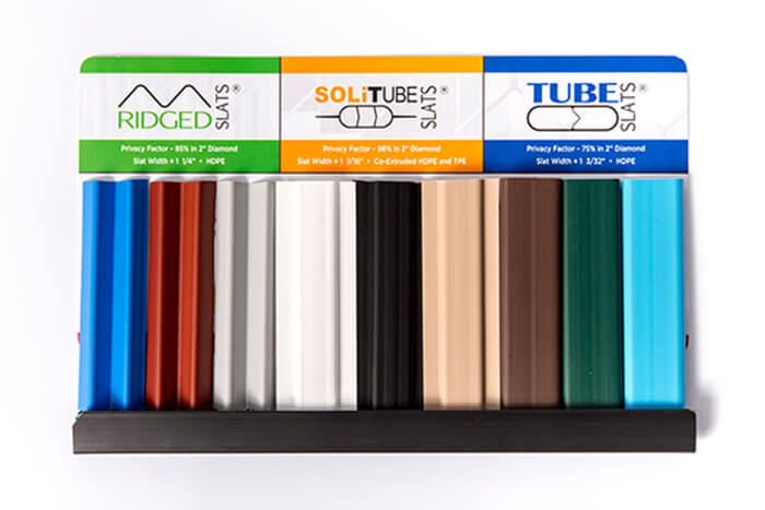 fence slat sample pack, three short samples each of ridged slats (in blue, redwood, and gray), solitube slats (in white, black, and beige), and tube slats (in brown, green, and sky blue)
